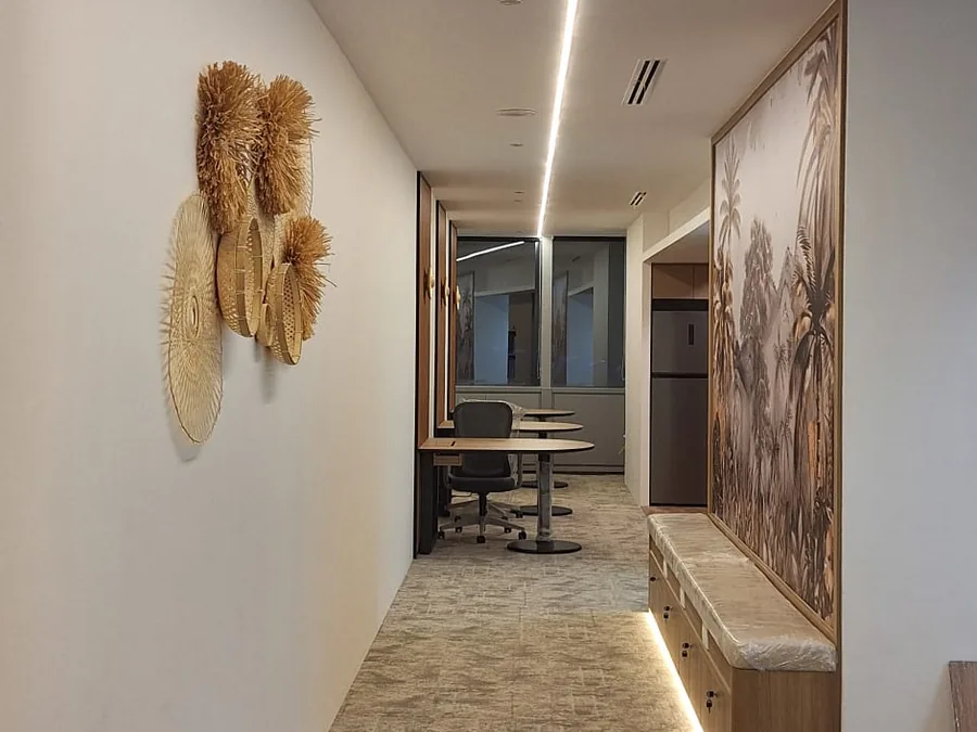 Office corridor with feature lighting and wall art